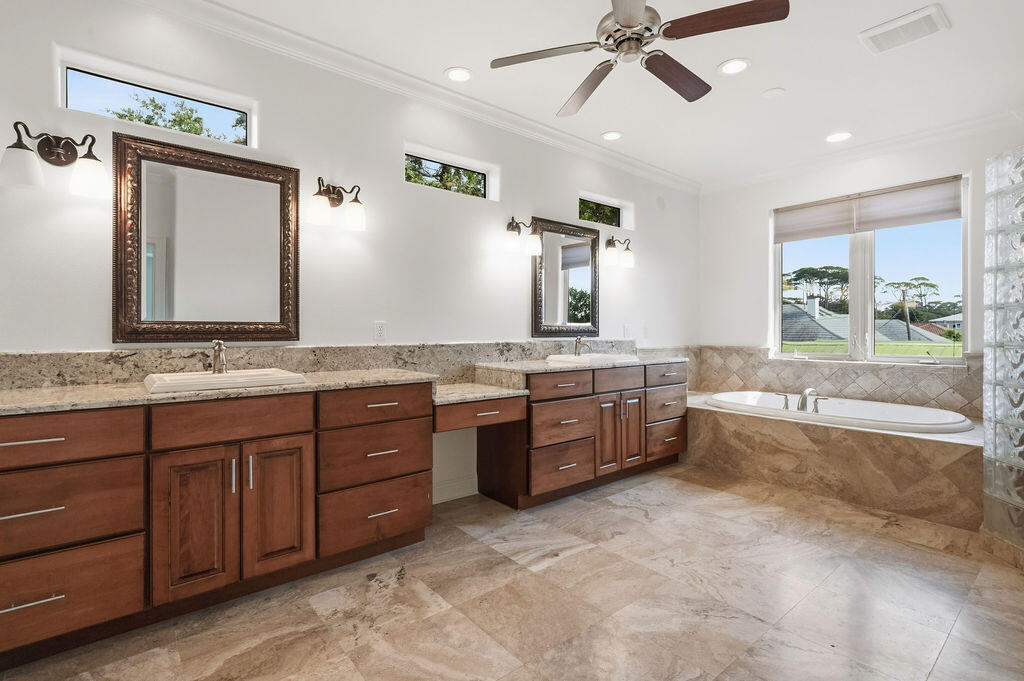 18 Kimbrough Road Mary Esther, FL 32569 - Photo 41 of 96 a large bathroom with a granite countertop tub double vanity and a mirror