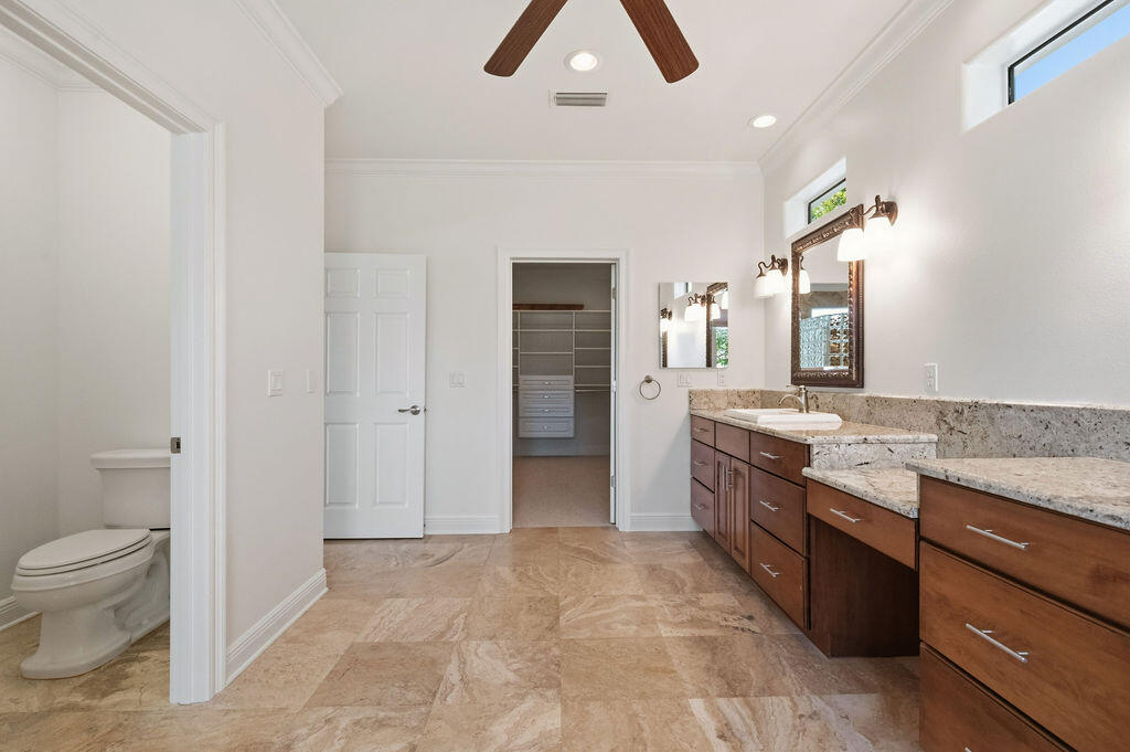 18 Kimbrough Road Mary Esther, FL 32569 - Photo 45 of 96 a spacious bathroom with a granite countertop sink a toilet and a vanity