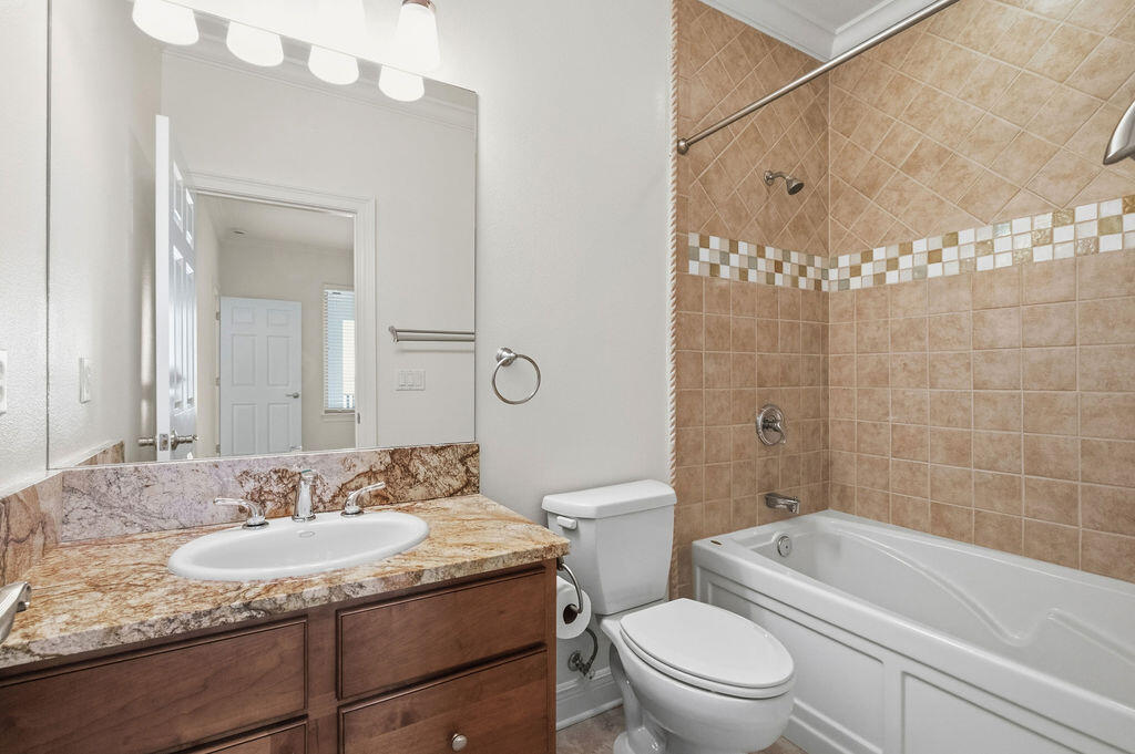18 Kimbrough Road Mary Esther, FL 32569 - Photo 51 of 89 a bathroom with a granite countertop sink a toilet mirror and shower