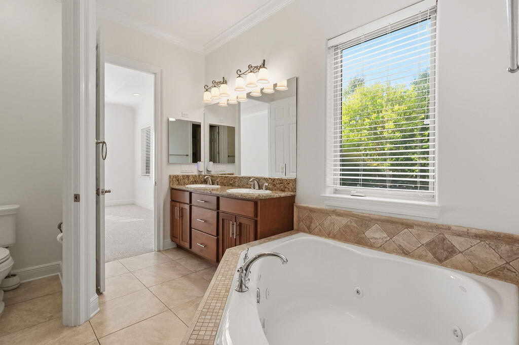 18 Kimbrough Road Mary Esther, FL 32569 - Photo 56 of 89 a bathroom with a tub sink and mirror