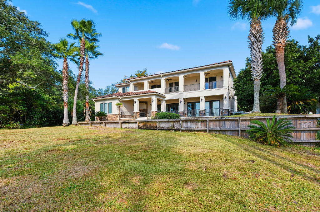 18 Kimbrough Road Mary Esther, FL 32569 - Photo 88 of 89 a view of a house with pool and a yard