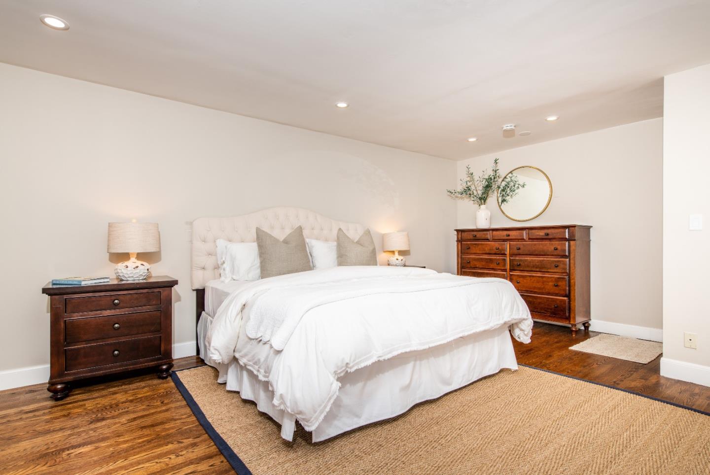 843 Crossway Road Burlingame, CA 94010 - Photo 15 of 36 a bedroom with a bed and wooden floor