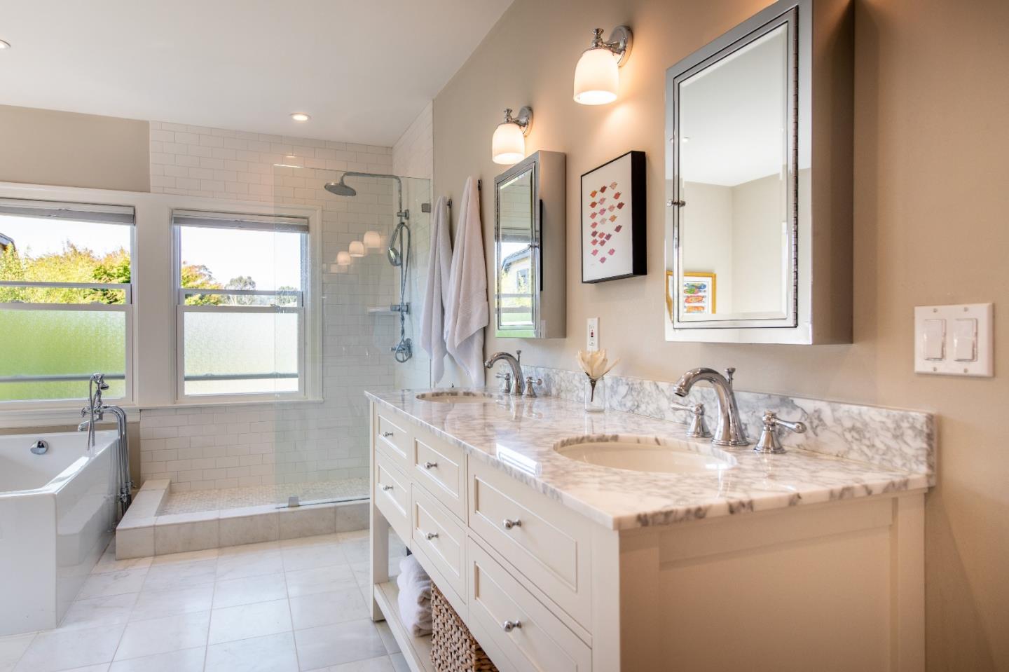 843 Crossway Road Burlingame, CA 94010 - Photo 17 of 36 a bathroom with a granite countertop sink mirror and a bathtub
