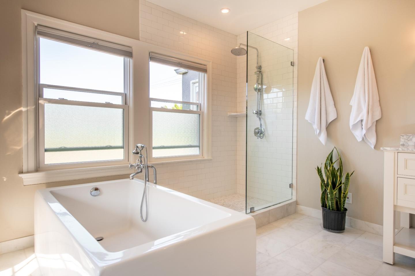 843 Crossway Road Burlingame, CA 94010 - Photo 18 of 36 a white bath tub sitting next to a shower