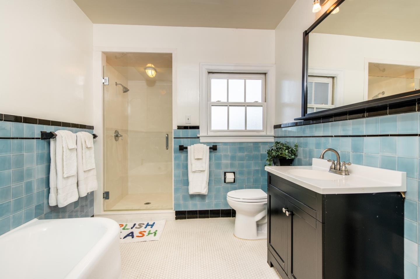 843 Crossway Road Burlingame, CA 94010 - Photo 22 of 36 a bathroom with a sink toilet and shower