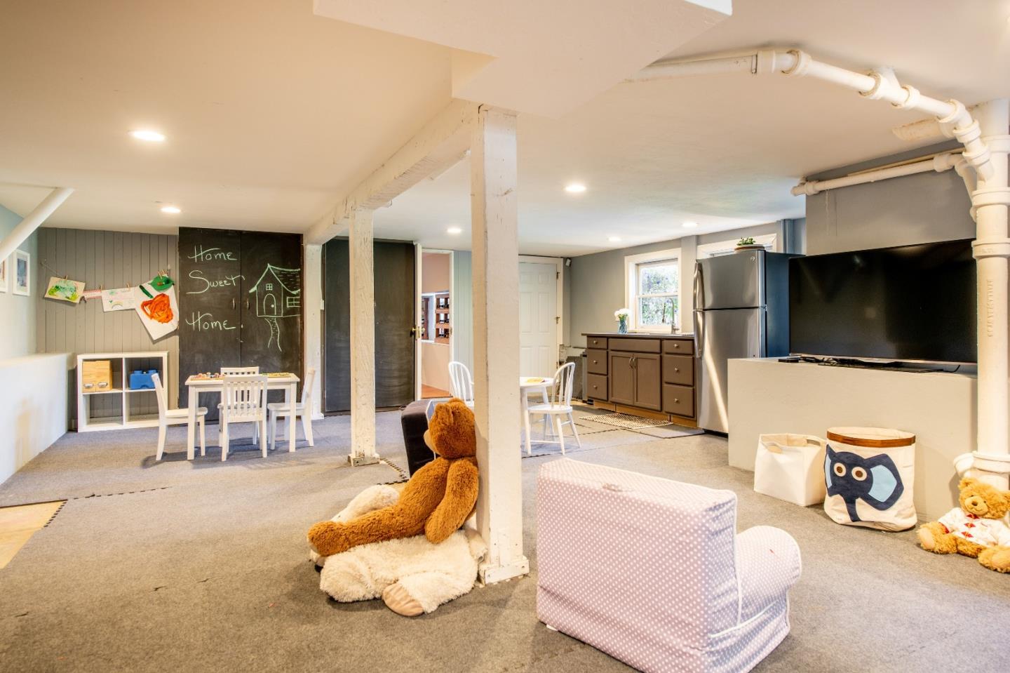 843 Crossway Road Burlingame, CA 94010 - Photo 25 of 36 a living room with furniture and a flat screen tv