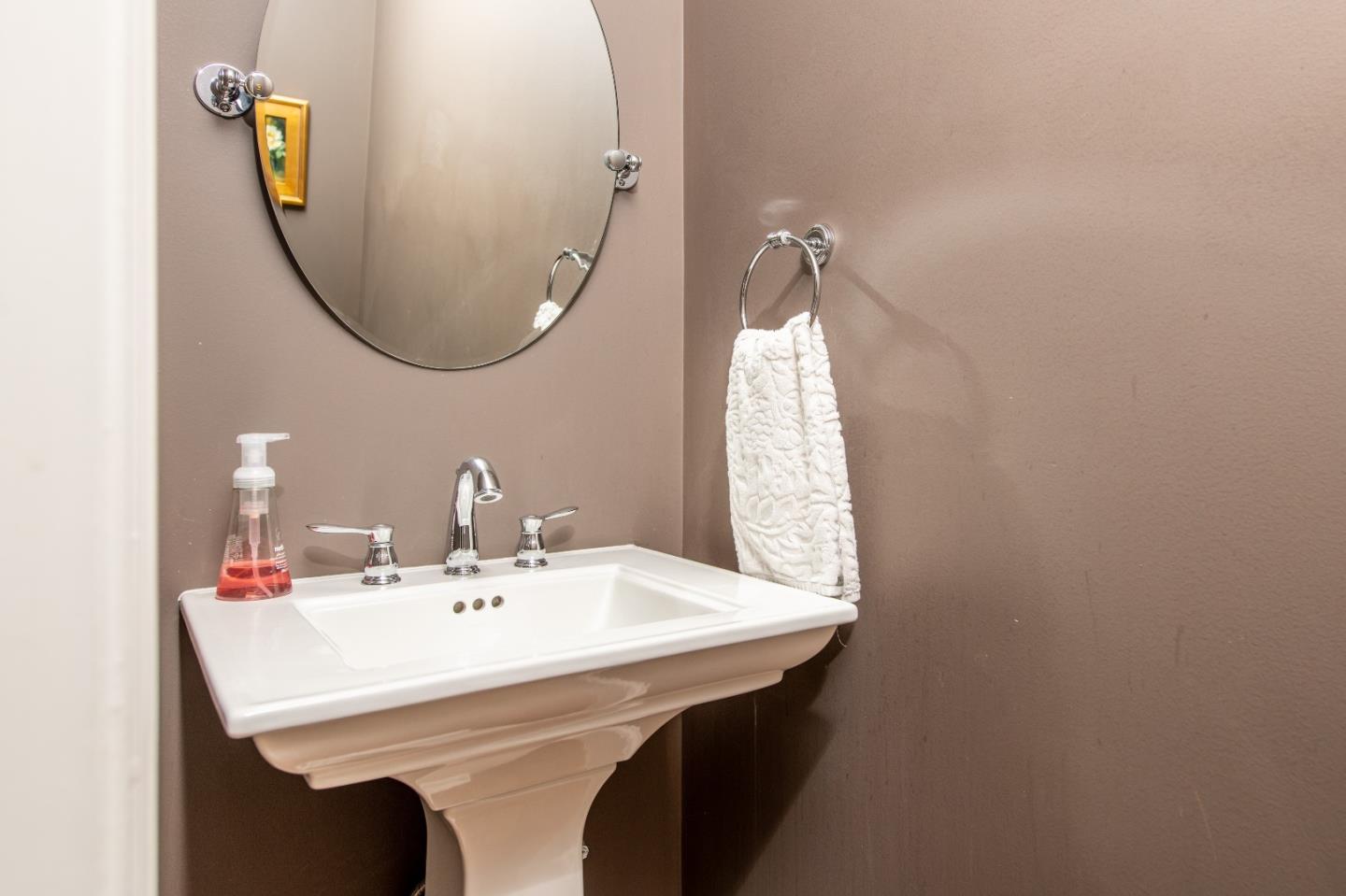 843 Crossway Road Burlingame, CA 94010 - Photo 30 of 36 a bathroom with a sink and a mirror