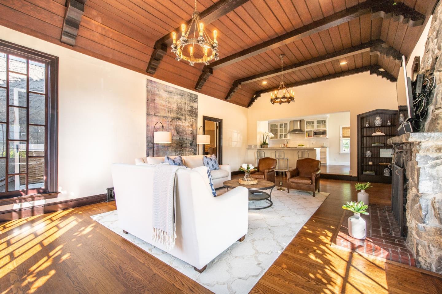 843 Crossway Road Burlingame, CA 94010 - Photo 6 of 36 a living room with patio furniture and a fireplace