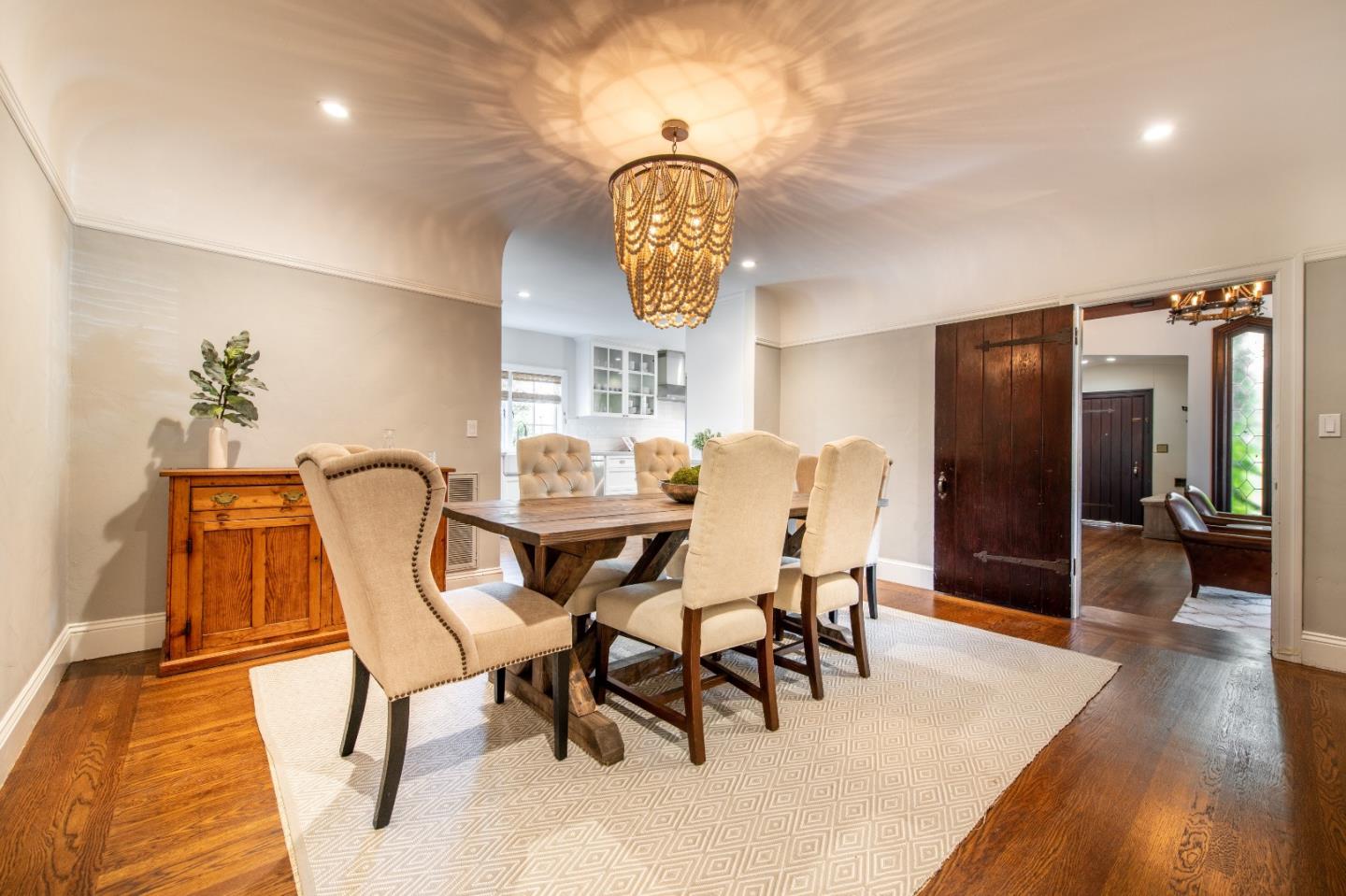 843 Crossway Road Burlingame, CA 94010 - Photo 8 of 36 a dining room with furniture and wooden floor