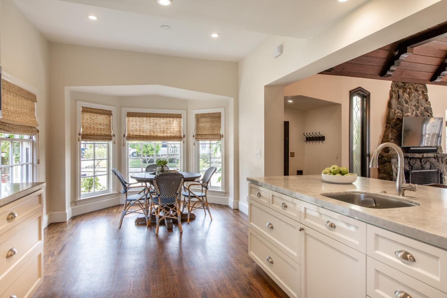 843 Crossway Road Burlingame, CA 94010 - Photo 10 of 36 a view of a dining room with furniture and wooden floor
