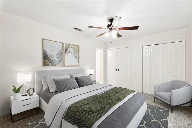 a bathroom with a sink vanity and toilet