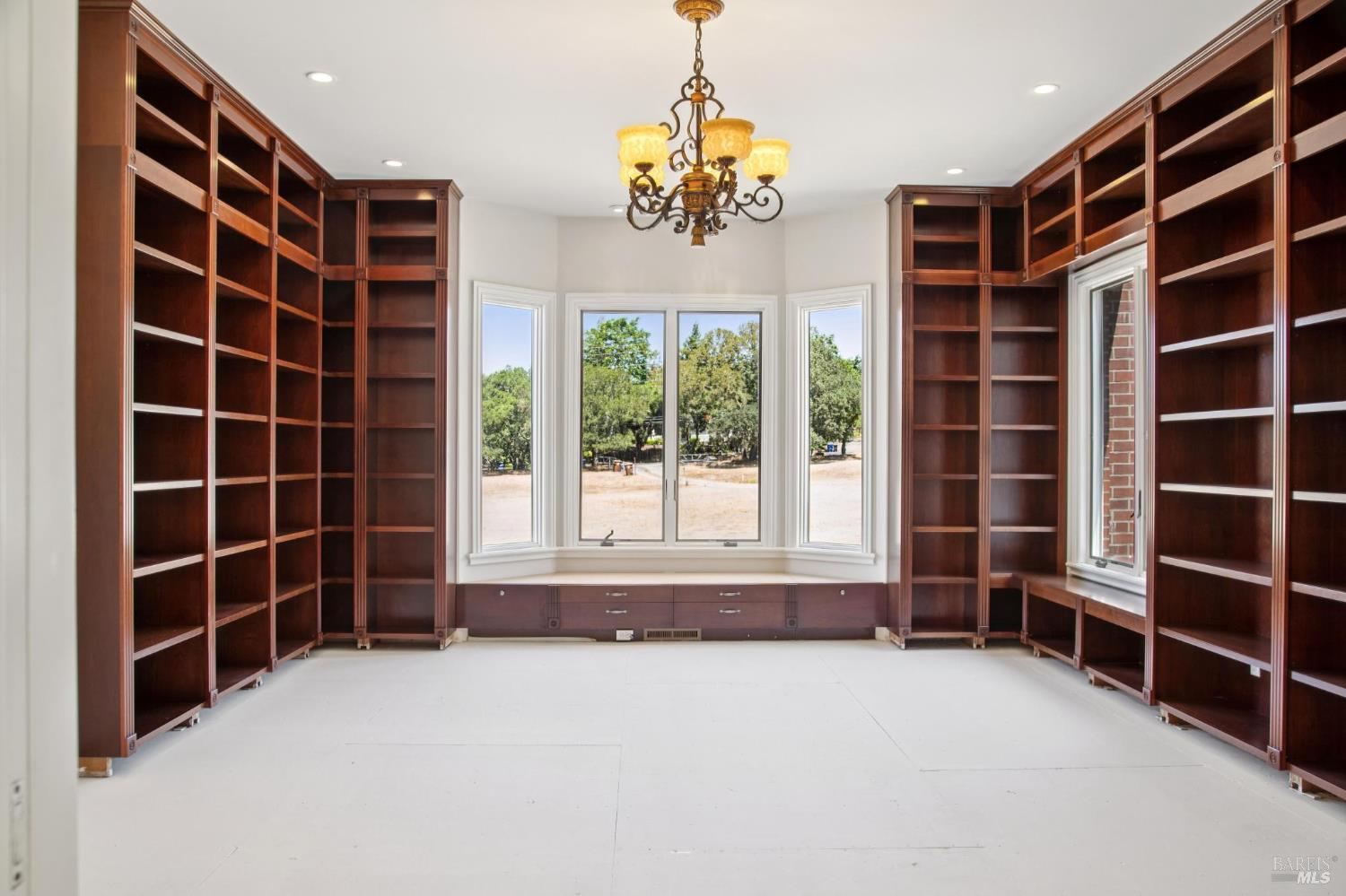 5151 Wild Horse Valley Road Napa, CA 94558 - Photo 14 of 83 a view of an empty room with a window and cabinet