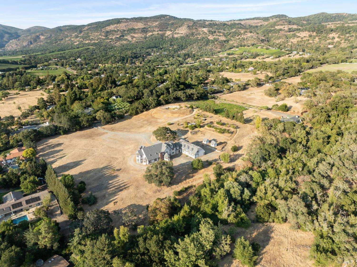 5151 Wild Horse Valley Road Napa, CA 94558 - Photo 30 of 81 a view of a field with mountains in the background