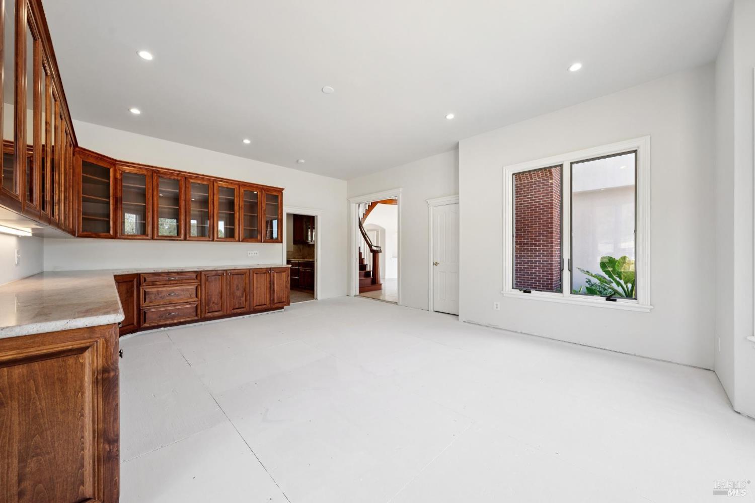 5151 Wild Horse Valley Road Napa, CA 94558 - Photo 9 of 83 a view of an empty room with windows