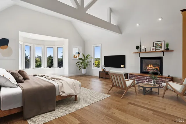 a view of an empty room with a fireplace and a window