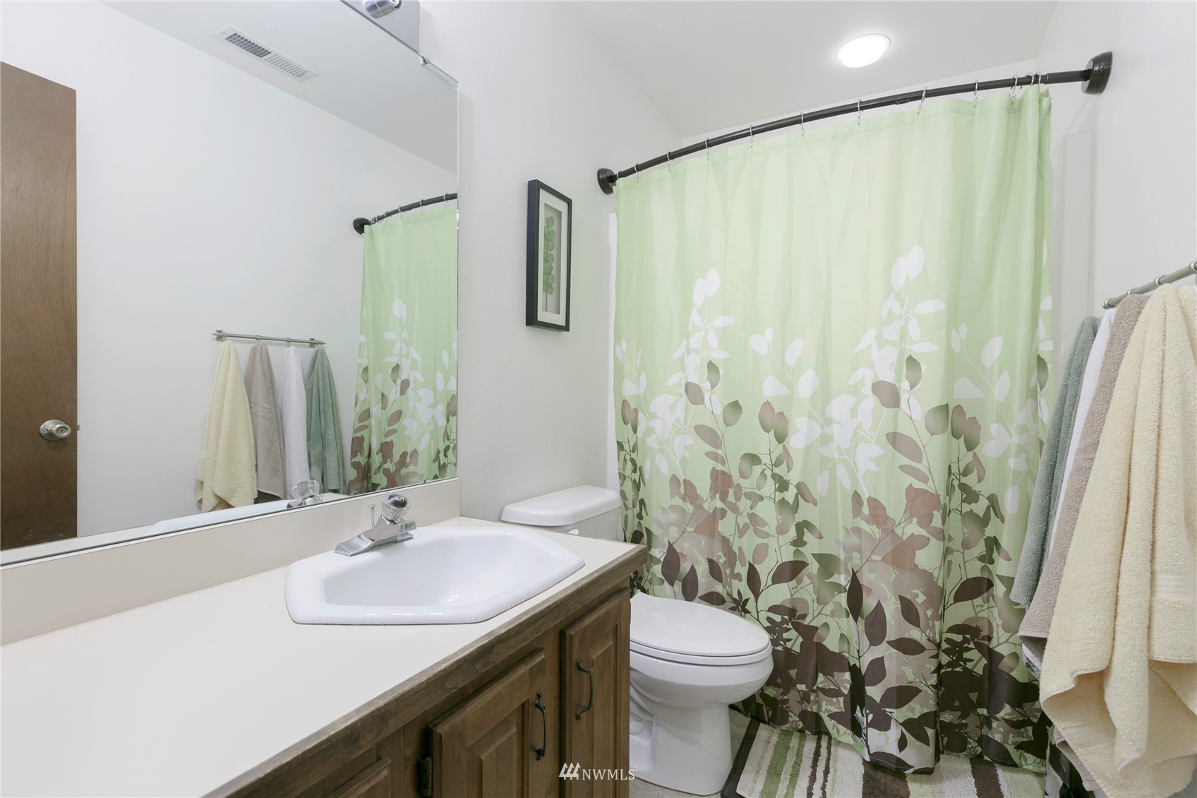 24 Burning Tree Drive Yakima, WA 98902 - Photo 18 of 18 a bathroom with a sink and a mirror