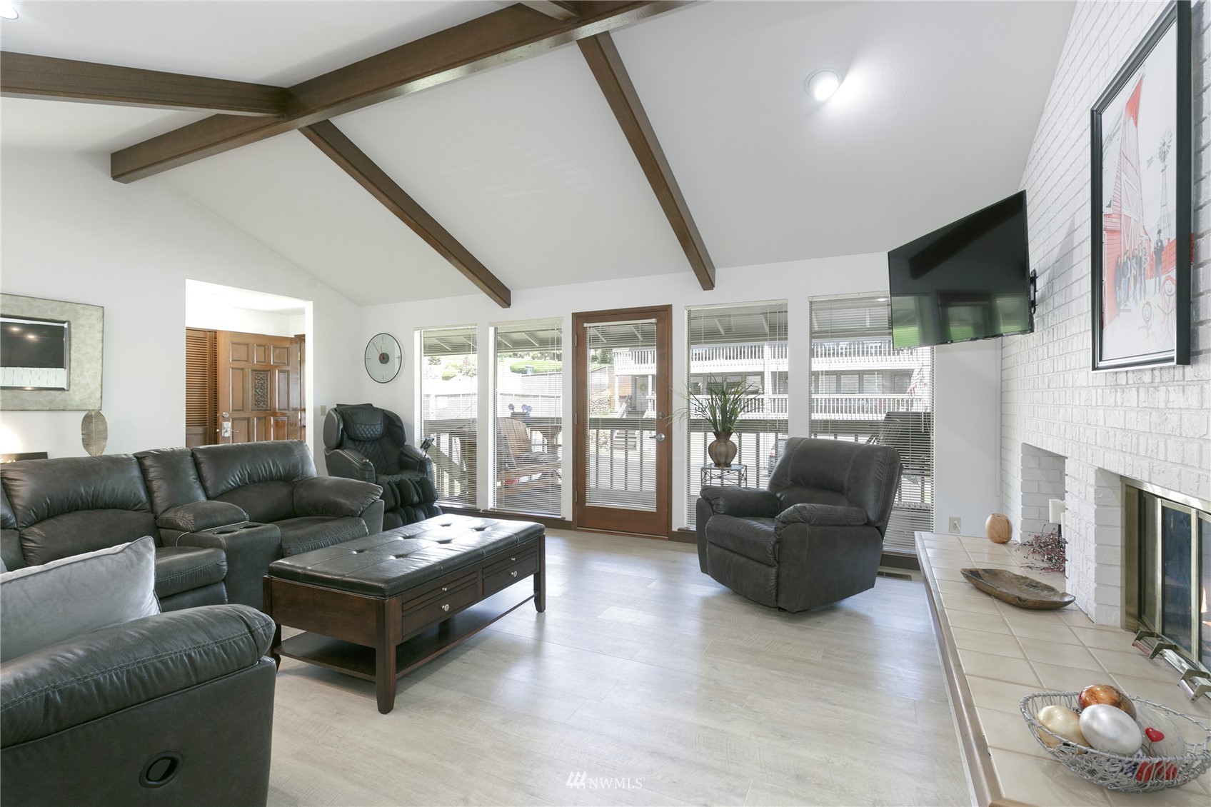 24 Burning Tree Drive Yakima, WA 98902 - Photo 5 of 18 a living room with furniture a flat screen tv and a fireplace