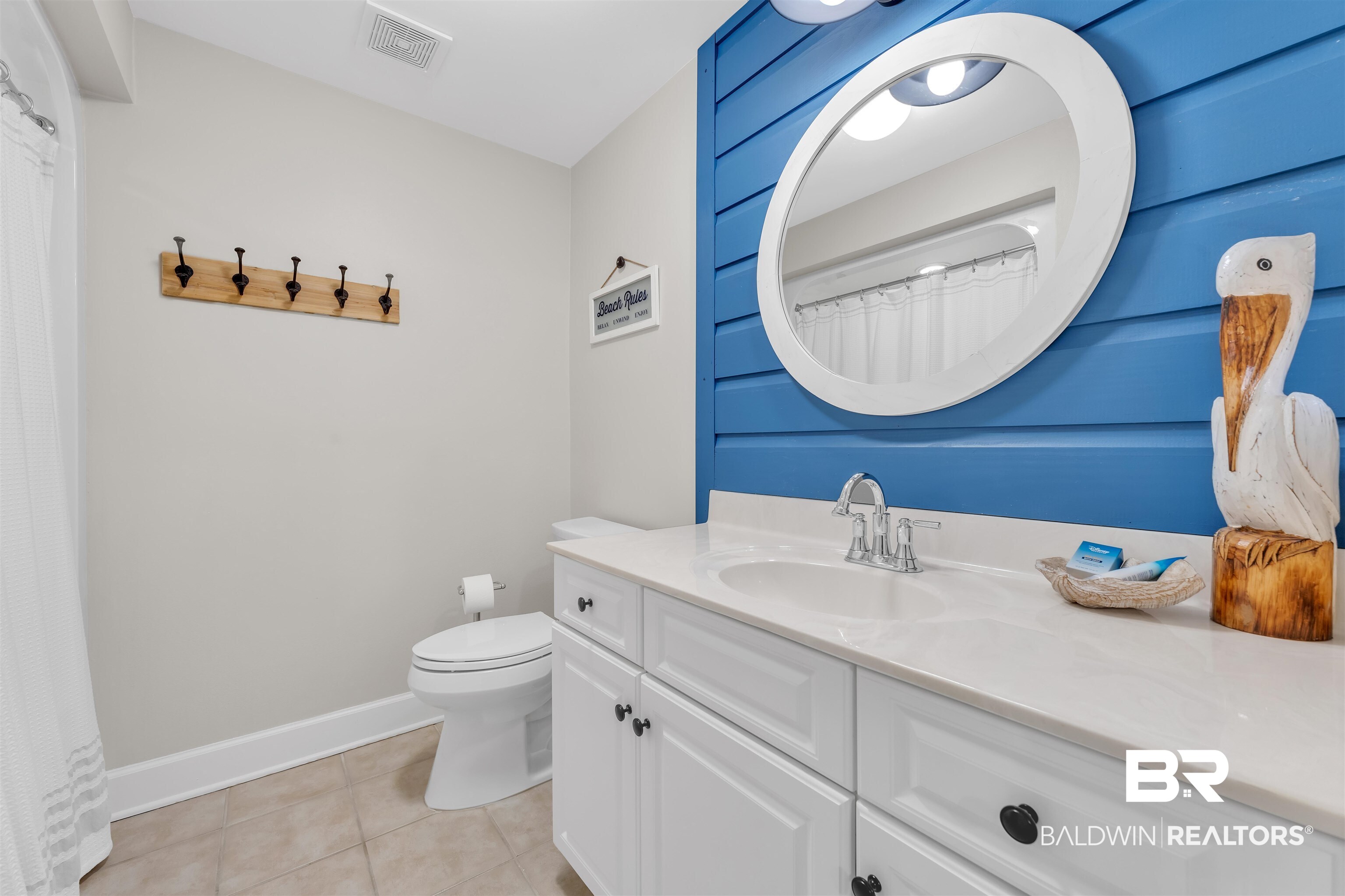 27582 Canal Road, Unit 2605 Orange Beach, AL 36561 - Photo 22 of 41 Full bath featuring tile patterned flooring, vanity, toilet, baseboards, and curtained shower