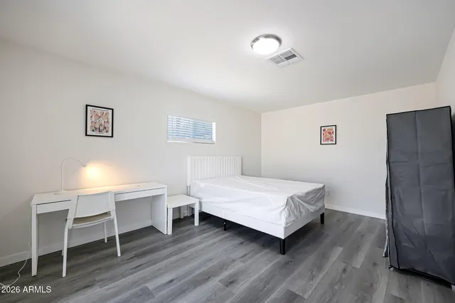 a room with a bed and a chair