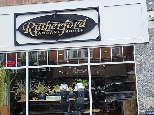 a view of a sign that is sitting in front of a building