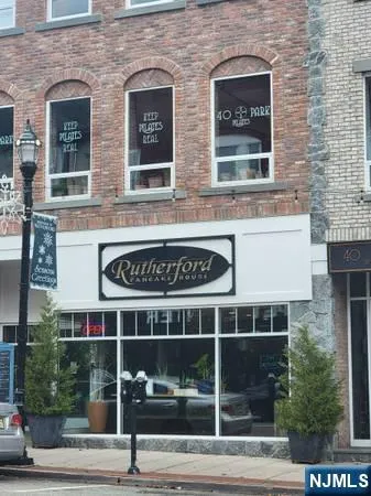 a view of a building with a window and a bench