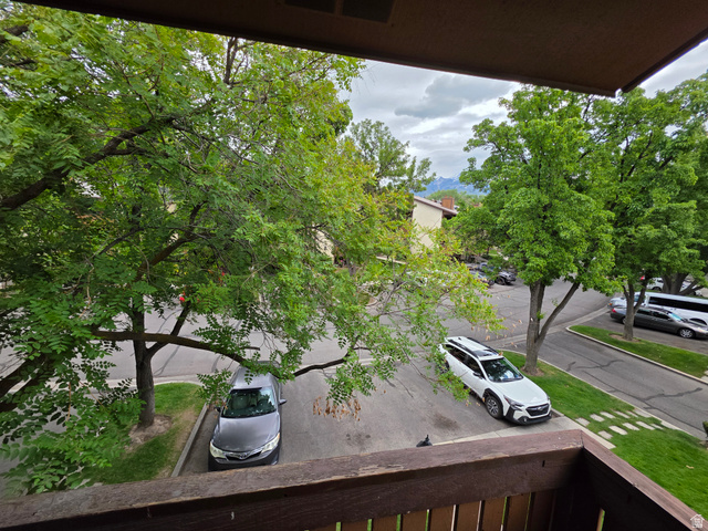 6852 Countrywoods Circle, Unit 5D Midvale, UT 84047 - Photo 10 of 50 Private Balcony, guest parking in front of building.