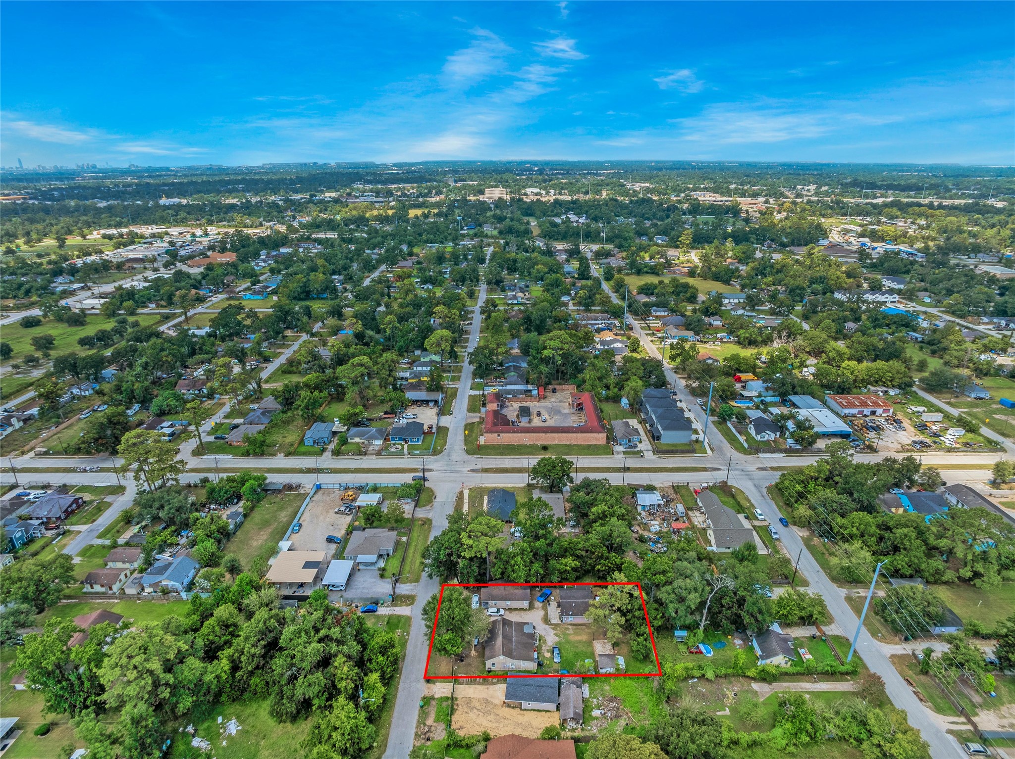 4915 Fitch Street Houston, TX 77016 - Photo 5 of 13 an aerial view of a city with lots of residential buildings ocean and mountain view in back