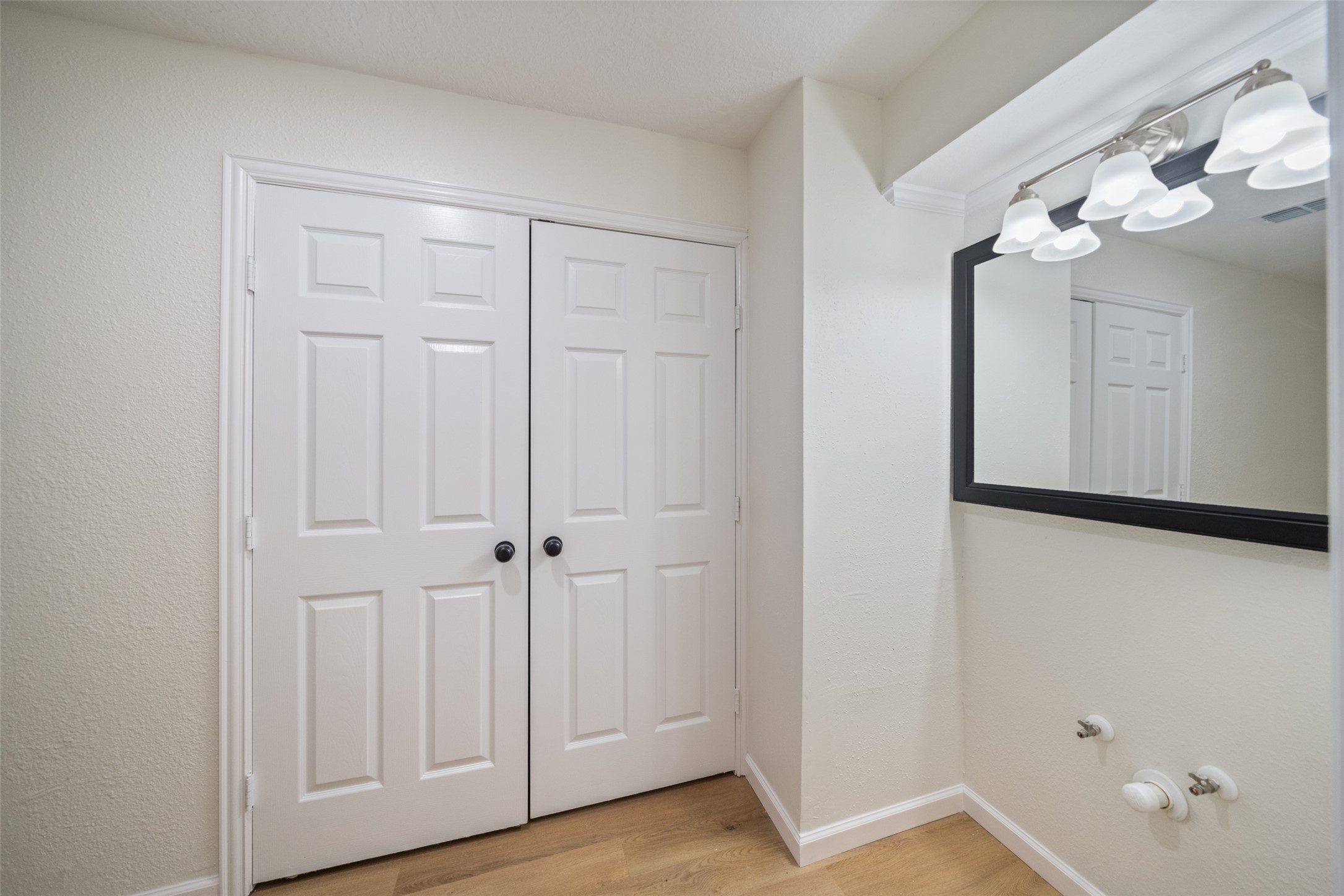 238 Point Clear Drive Conroe, TX 77304 - Photo 12 of 20 a view of a hallway with wooden floor