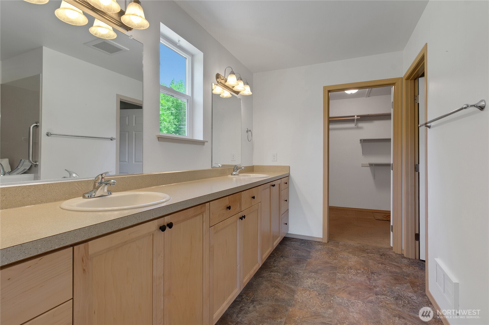 1450 Southeast Spruce Road Port Orchard, WA 98367 - Photo 19 of 39 a bathroom with a double vanity sink and a mirror