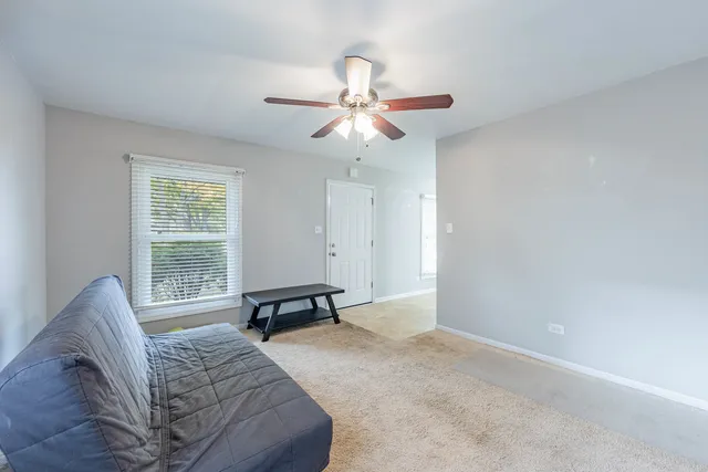 a bedroom with a bed furniture and a window