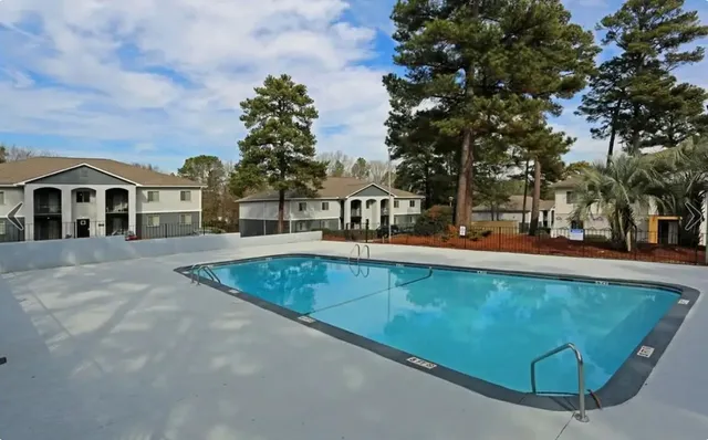 a view of swimming pool with trees