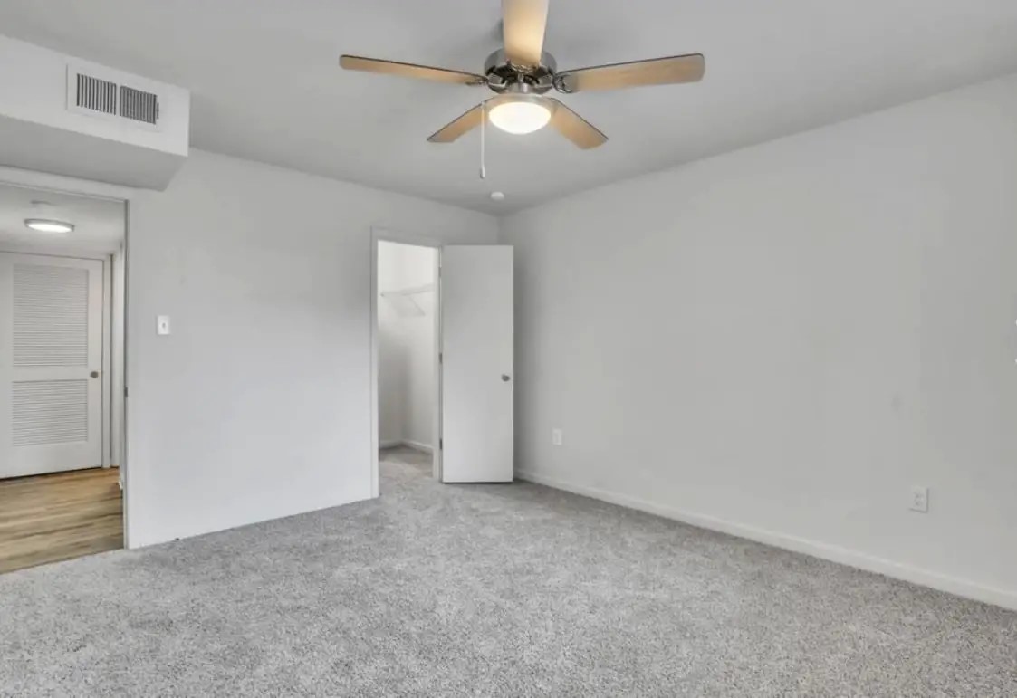 1401 Longcreek Drive Columbia, SC 29210 - Photo 7 of 9 en empty room with fan and a ceiling fan