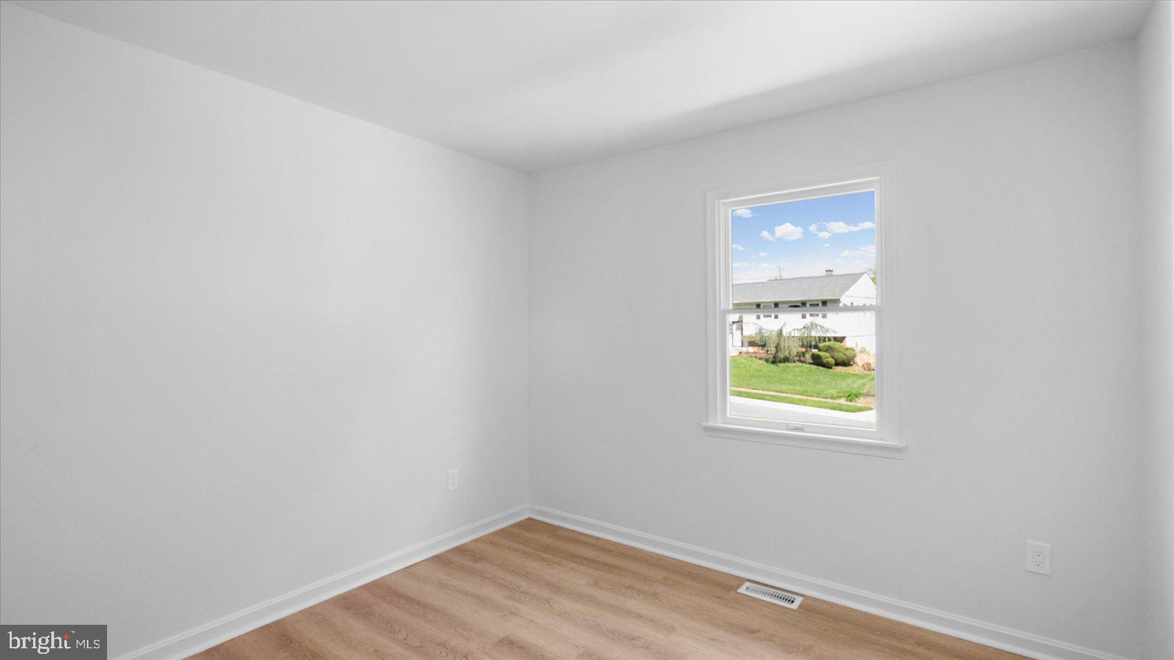 804 Suburbian Road Reisterstown, MD 21136 - Photo 16 of 36 a view of room with window and wooden floor