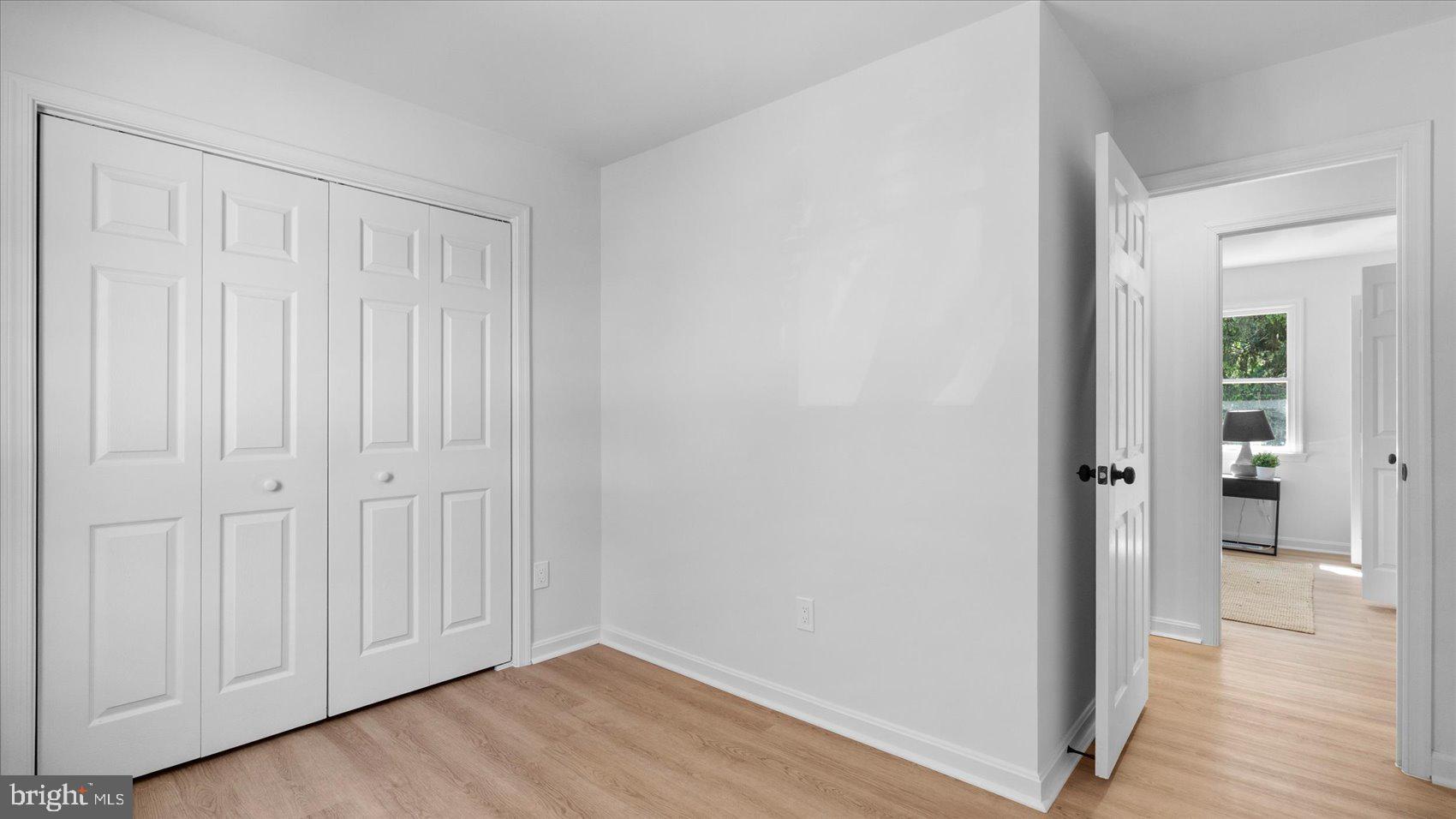 804 Suburbian Road Reisterstown, MD 21136 - Photo 22 of 36 a view of an empty room and wooden floor
