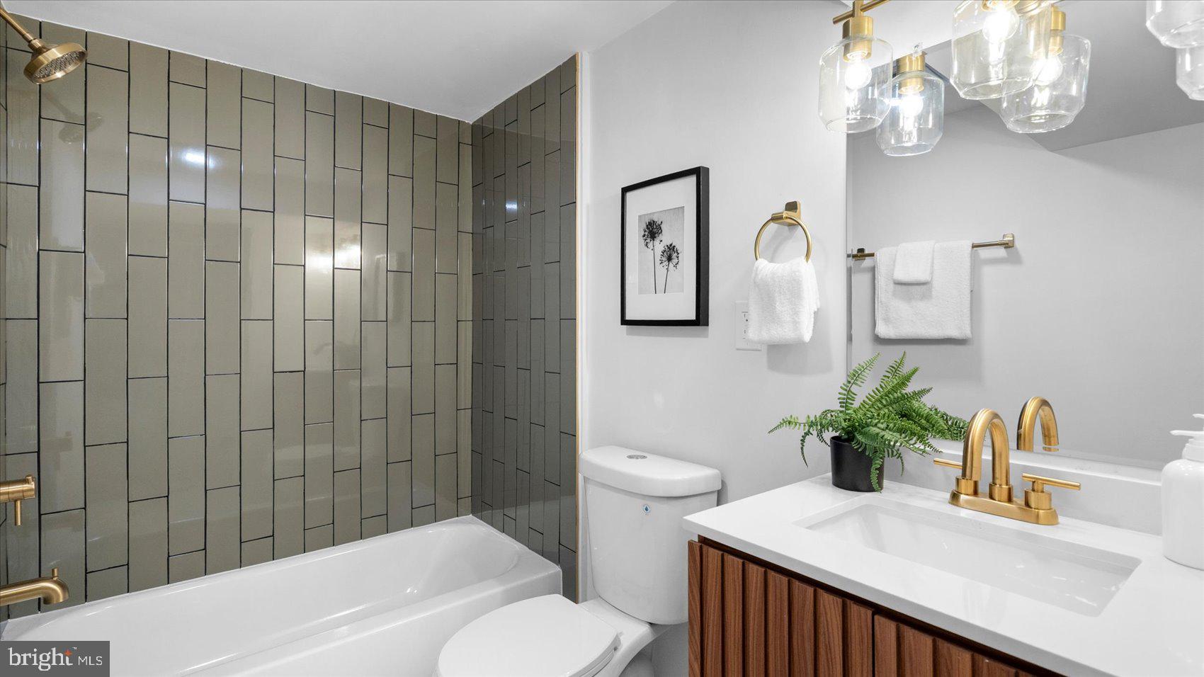 804 Suburbian Road Reisterstown, MD 21136 - Photo 27 of 36 a bathroom with a sink a toilet and shower