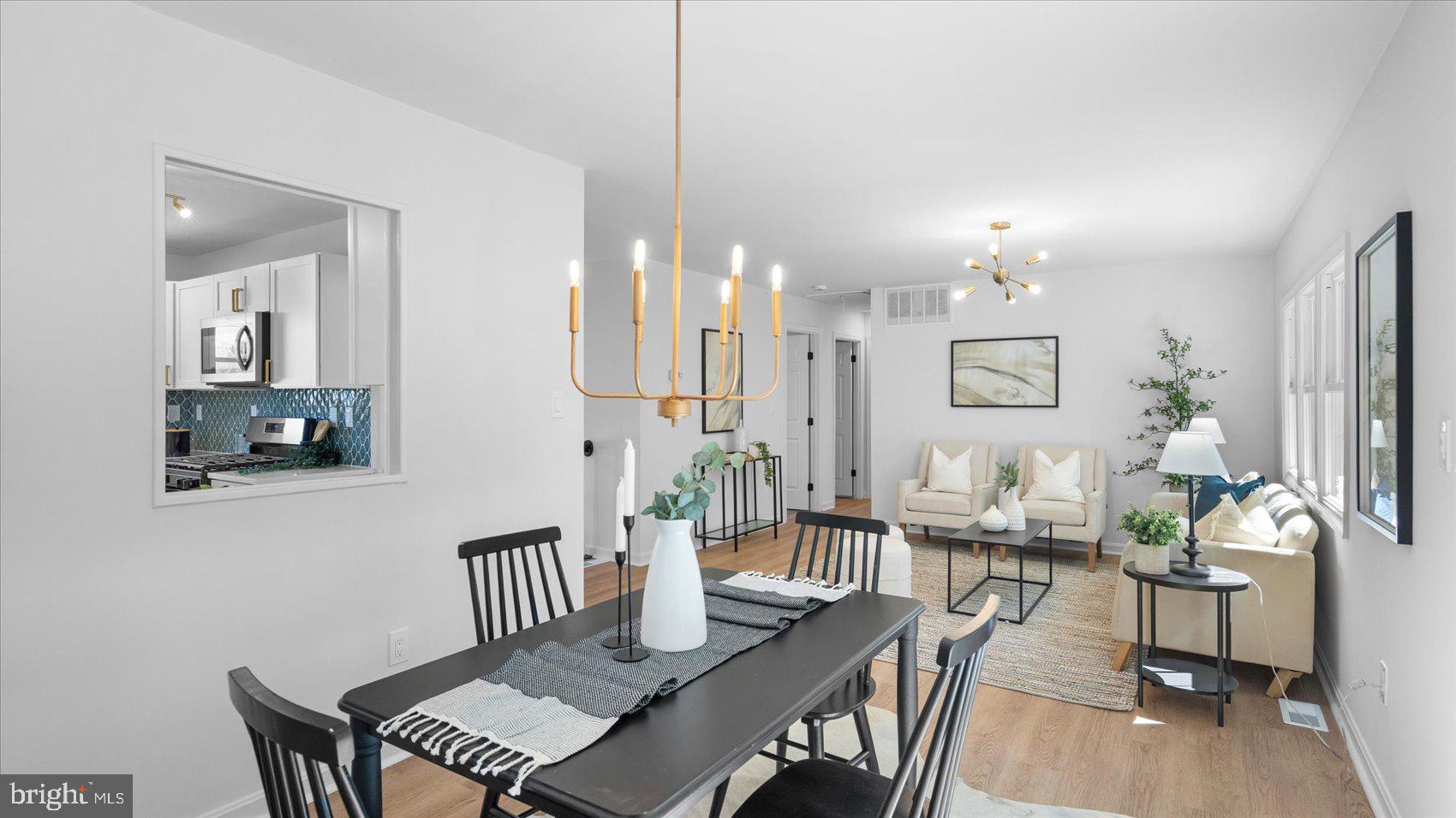 804 Suburbian Road Reisterstown, MD 21136 - Photo 10 of 36 a view of a a dining room with furniture a livingroom and chandelier