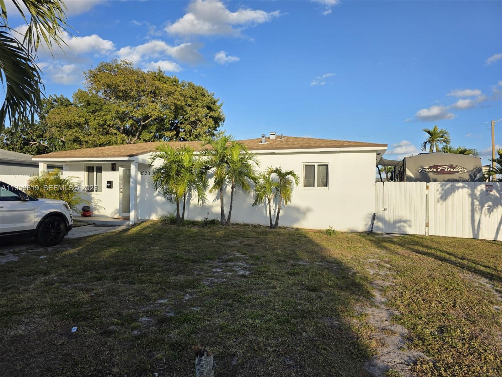 8523 Northwest 35th Place Miami, FL 33147 - Photo 2 of 10 a front view of a house with a yard