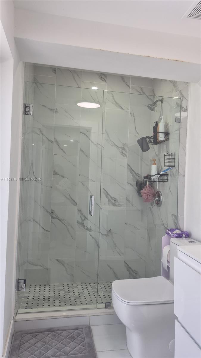 8523 Northwest 35th Place Miami, FL 33147 - Photo 9 of 10 a bathroom with a toilet and a shower