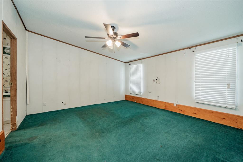 1312 Crowell Road Kaufman, TX 75142 - Photo 12 of 38 a view of an empty room with a window