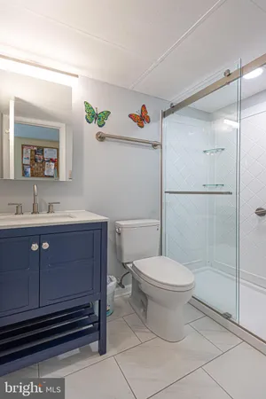 a bathroom with a sink vanity and a mirror