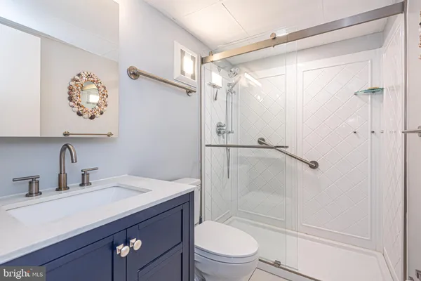 a view of a city with tall buildings and a big yard