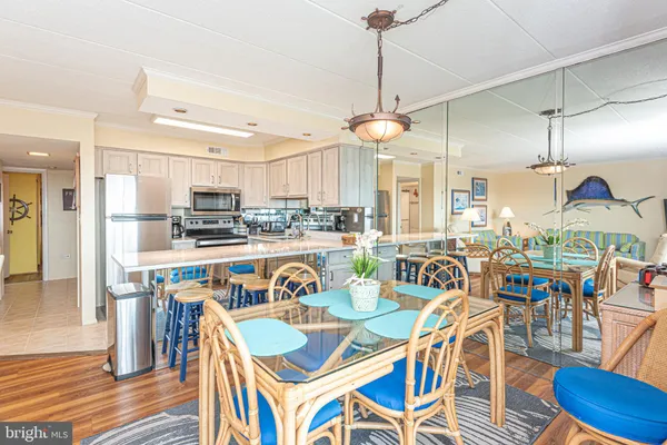 a kitchen with a sink cabinets stainless steel appliances and a window