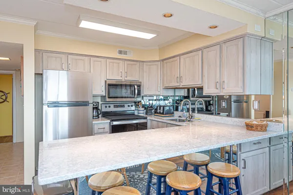 a bedroom with furniture and a chandelier
