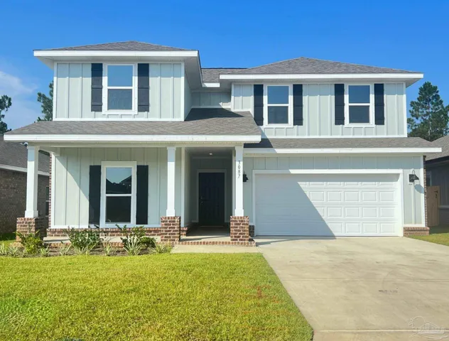 front view of a house with a yard
