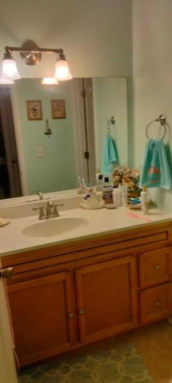 106 Gettysburg Place Atlanta, GA 30350 - Photo 14 of 15 a bathroom with a sink and a mirror