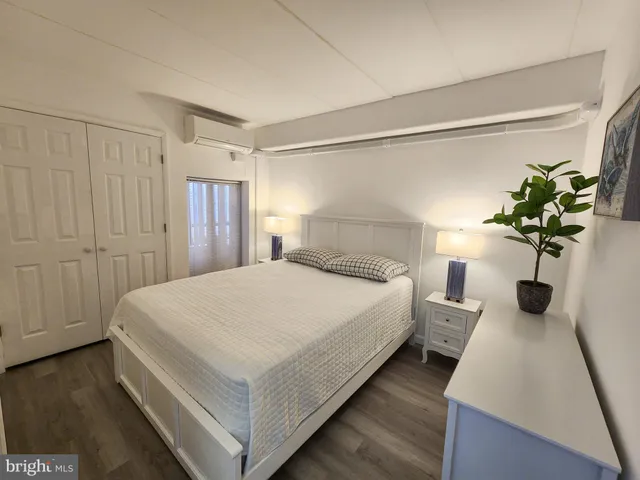 a large bed sitting in a bedroom next to a bathroom
