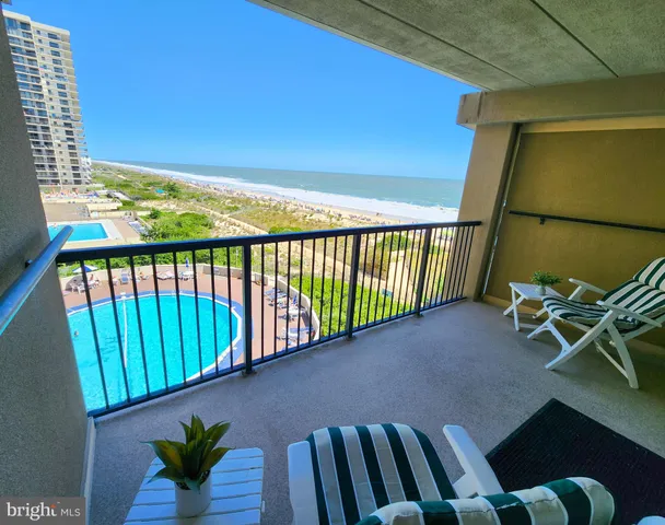 a view of balcony with furniture
