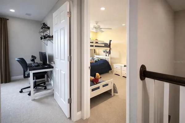 a view of a bedroom with gym equipment and equipment
