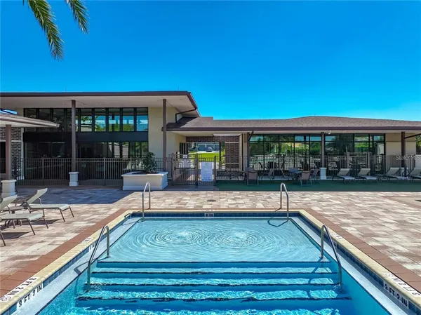 a view of swimming pool with outdoor seating