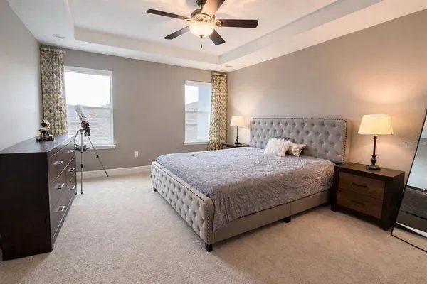 a bedroom with a bed and window